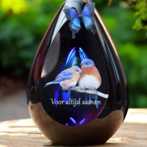 Glass design urn with blue ash chamber and image of two birds with the text Together forever – suitable for cremation ashes.
