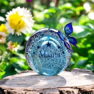 Ball urn and butterfly of blue transparent glass.