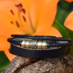 Memorial bracelet with lock of hair embedded in central bead