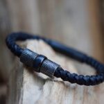 Leather bracelet with invisible cremation ashes sealed in stainless steel bead