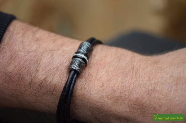made to measure with three leather strands.