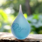 Small frosted blue glass urn with sandblasted heart