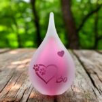 Small frosted pink glass urn with sandblasted heart and paw prints