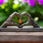 Sculpture of two hands forming a heart