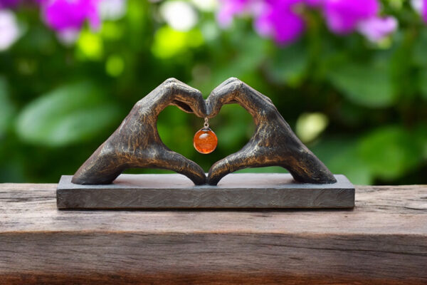 Sculpture of two hands forming a heart
