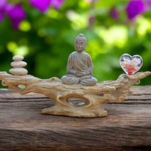 Buddha on wooden branch