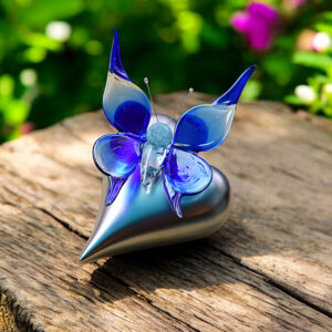Blue glass butterfly on silver-colored heart