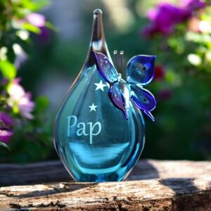 Urn and butterfly of blue transparent glass.