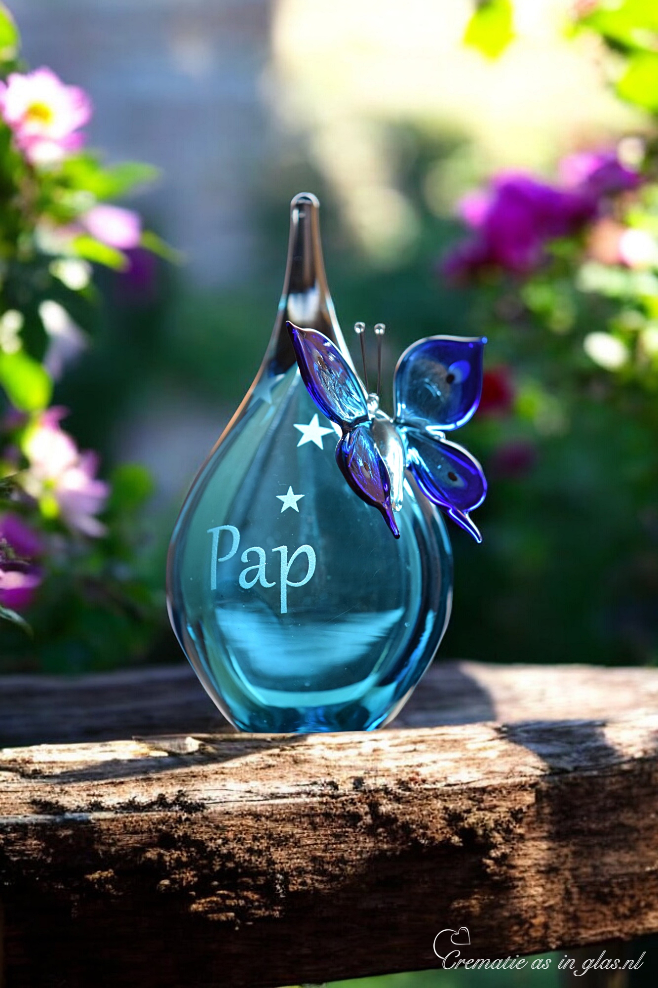 Urn and butterfly of blue transparent glass.