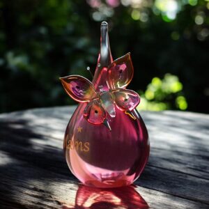 Urn and butterfly of pink transparent glass.