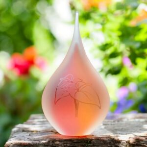 Medium urn of pink and yellow glass.