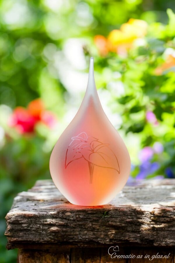 Medium urn of pink and yellow glass.