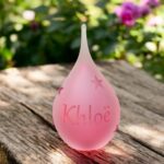 Urn of pink glass. Cremation ash urn glass personalized to keep as a precious memory