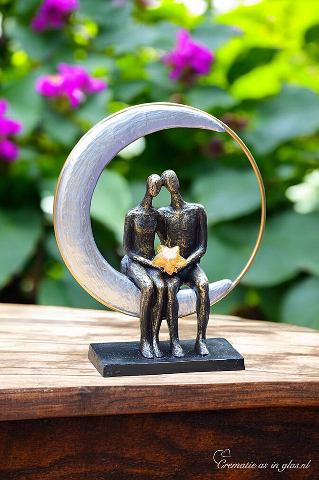 Two figures seated in moon-sun circle