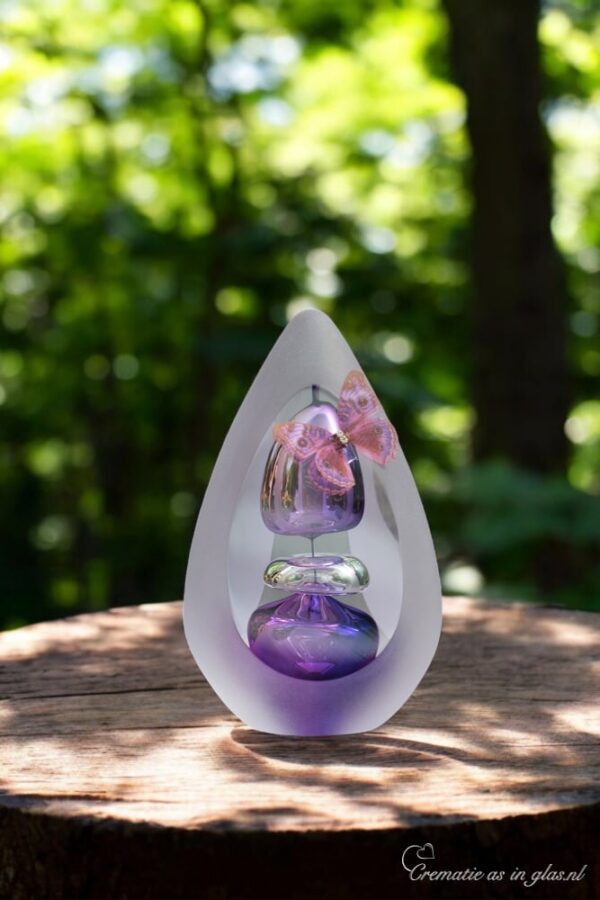 Handmade glass urn in purple with air bubbles