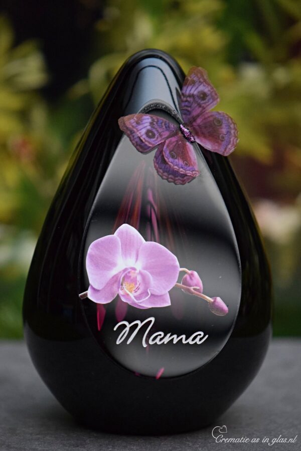 Design urn made of glass with transparent pink ash chamber and image of a pink orchid with space for a short name – suitable for cremation ashes.