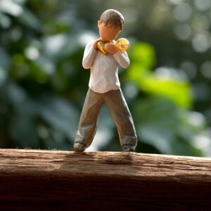 Willow Tree figurine A Heart of Gold boy holding gold heart with mini urn on shoulder for ashes or a lock of hair