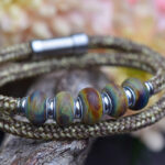 Natural-colored Sailrope bracelet with five handmade glass beads in earthy tones