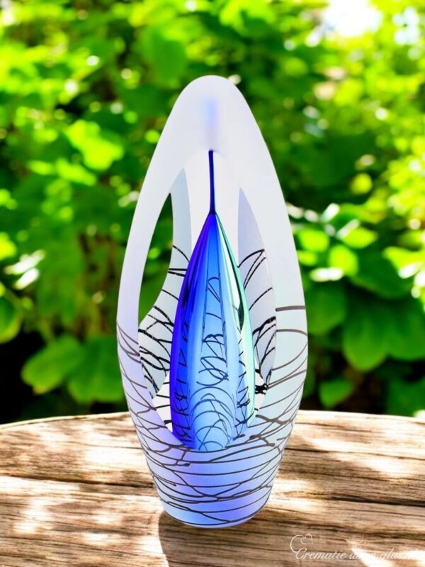 Design urn made of glass with transparent blue ash chamber