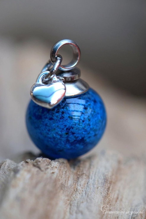 stainless steel bail and sterling silver heart charm.