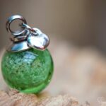 stainless steel bail and sterling silver heart charm.