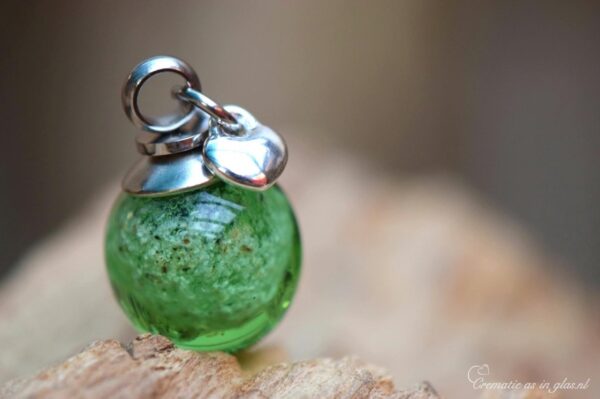 stainless steel bail and sterling silver heart charm.