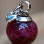 stainless steel bail and sterling silver heart charm.