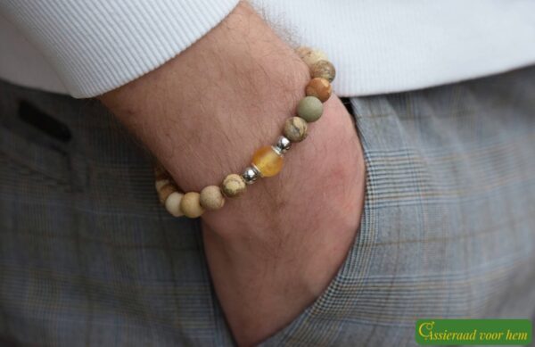 Men’s memorial bracelet with desert jasper beads and non-visible ashes in a matte yellow glass bead.
