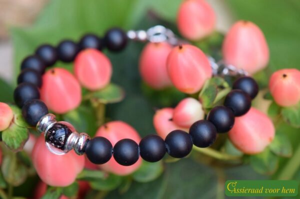 Men’s memorial bracelet with black onyx beads and semi-visible ashes in a black transparent glass bead.