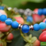 Men’s memorial bracelet with blue sardonyx beads and non-visible ashes in a matte blue glass bead.