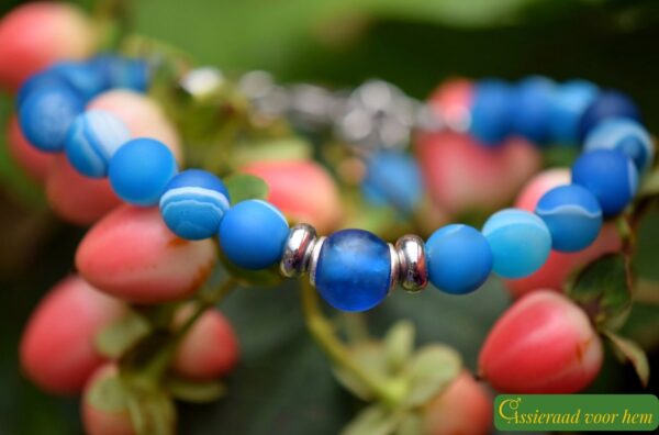 Men’s memorial bracelet with blue sardonyx beads and non-visible ashes in a matte blue glass bead.