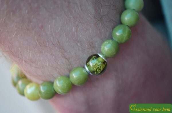 Men’s memorial bracelet with green serpentine beads and subtly visible ashes in a transparent green glass bead.