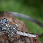 Elegant memorial bangle with invisible ashes in black shimmer glass