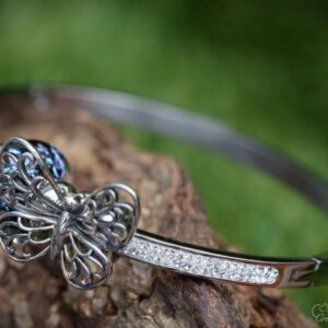 Elegant memorial bangle with invisible ashes in black shimmer glass