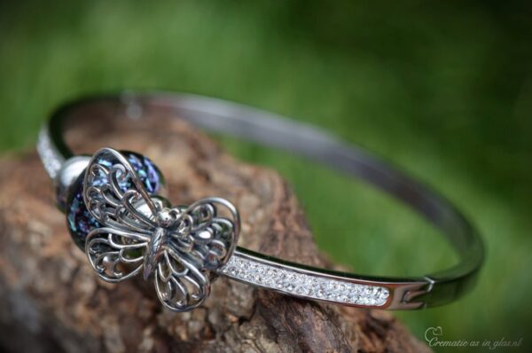 Elegant memorial bangle with invisible ashes in black shimmer glass