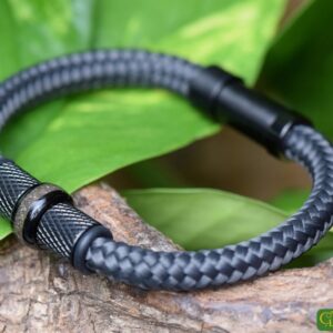 Grey Sailrope bracelet with black diamond-pattern stainless steel beads and cremation ash in the center bead.