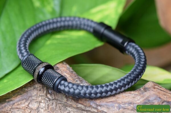 Grey Sailrope bracelet with black diamond-pattern stainless steel beads and cremation ash in the center bead.
