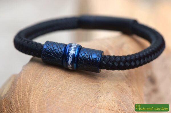 Black bracelet with blue stainless steel cremation ash bead and two design beads.