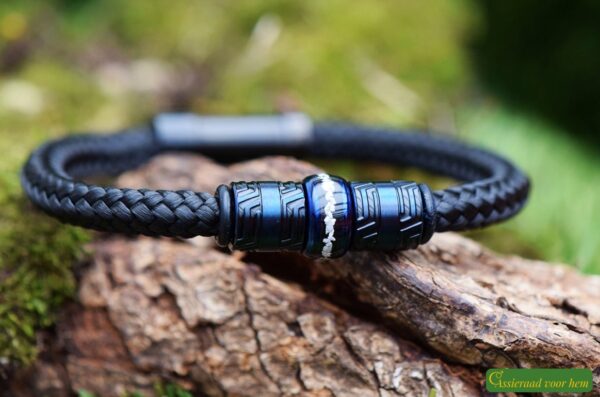 Black bracelet with cremation ashes in a blue stainless steel bead