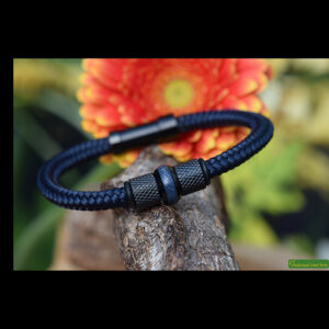 Dark blue Sailrope bracelet with black stainless steel beads and cremation ash in the center glass bead.