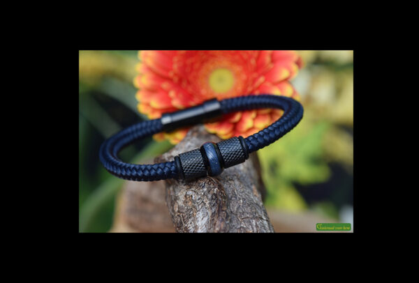 Dark blue Sailrope bracelet with black stainless steel beads and cremation ash in the center glass bead.