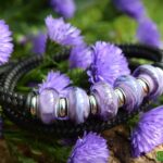 Bracelet with purple glass beads on black band