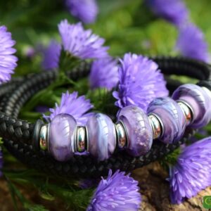 Bracelet with purple glass beads on black band