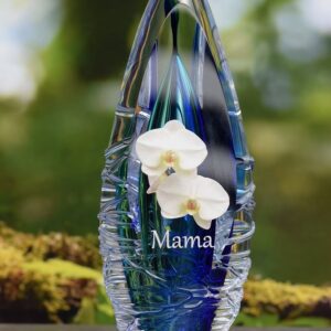 Design urn made of glass with transparent green-yellow ash chamber and image of white freesias – suitable for cremation ashes.