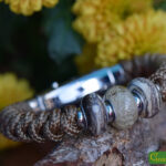 Men’s memorial bracelet in brown Sailrope with brown cremation ashes glass bead between two sandblasted mottled beads.