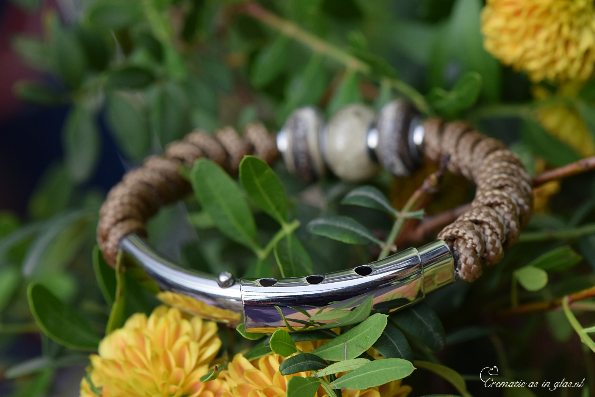 Men’s memorial bracelet in brown Sailrope shown from the back side with stainless steel components and ashes glass bead.