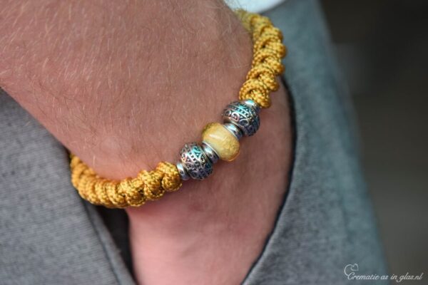 flanked by two silver-tone design beads.