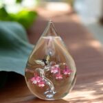 Glass urn with hollow compartment