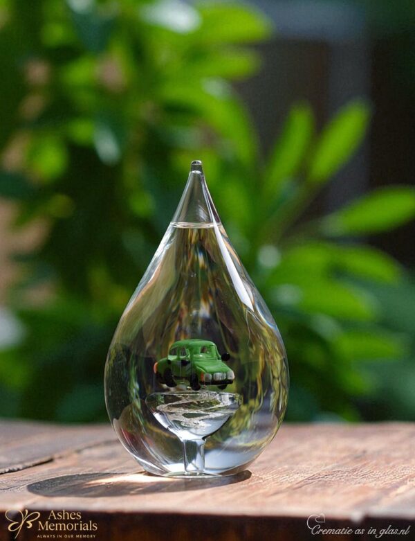 Glass urn with miniature car in green glass