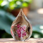 Glass urn with hollow compartment